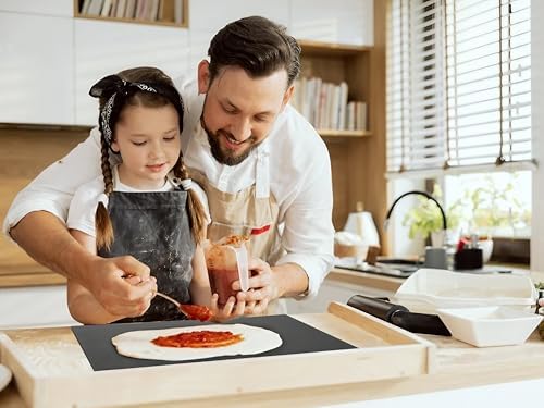Family making pizza at home